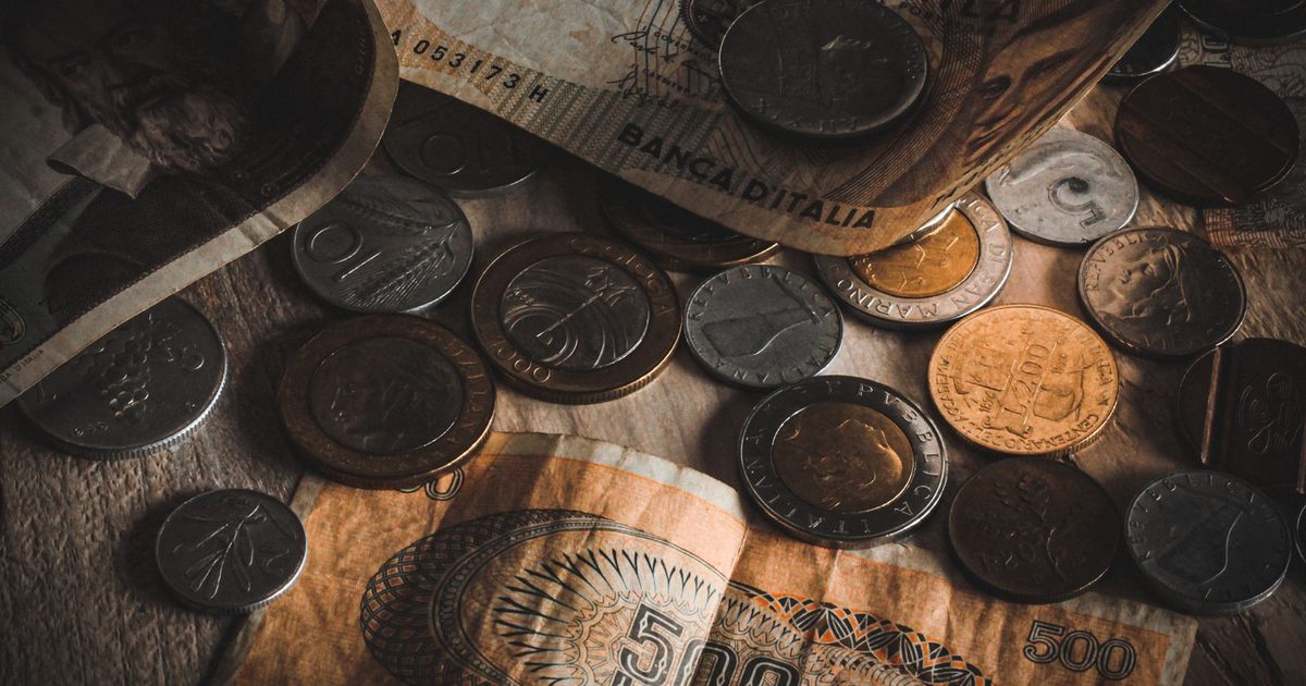 Vintage coins and banknotes on a table