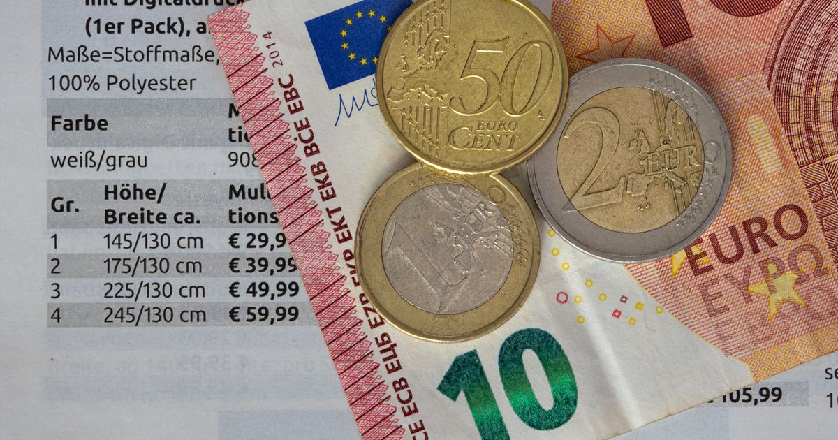 Euro coins and notes on a price list