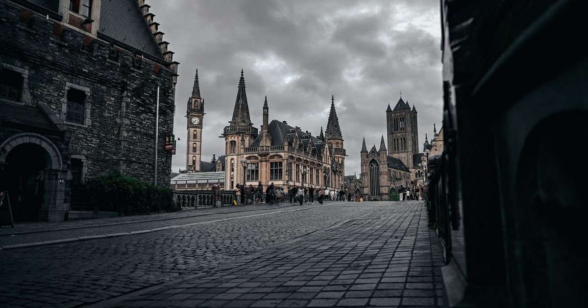 Historic architecture in Ghent, Belgium, under a cloudy sky