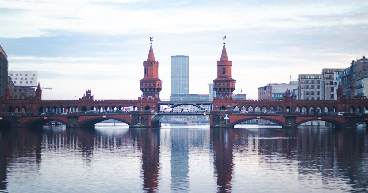 The Oberbaum Bridge reflected in the River Spree at dusk, Berlin