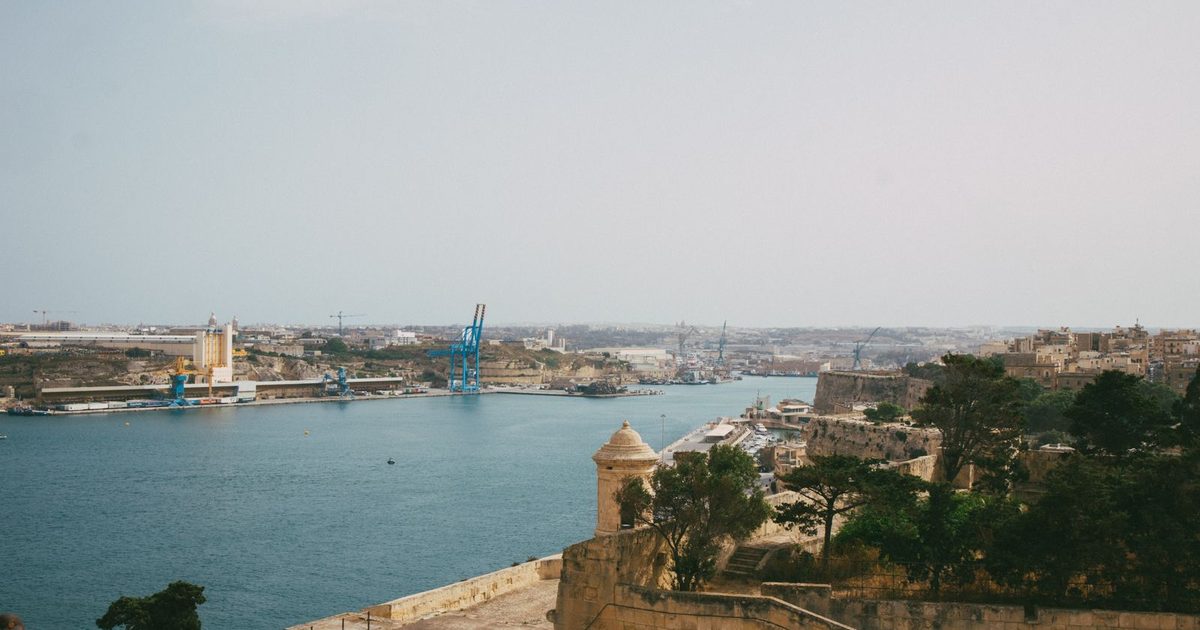 Valletta harbour and its historic architecture under an overcast sky