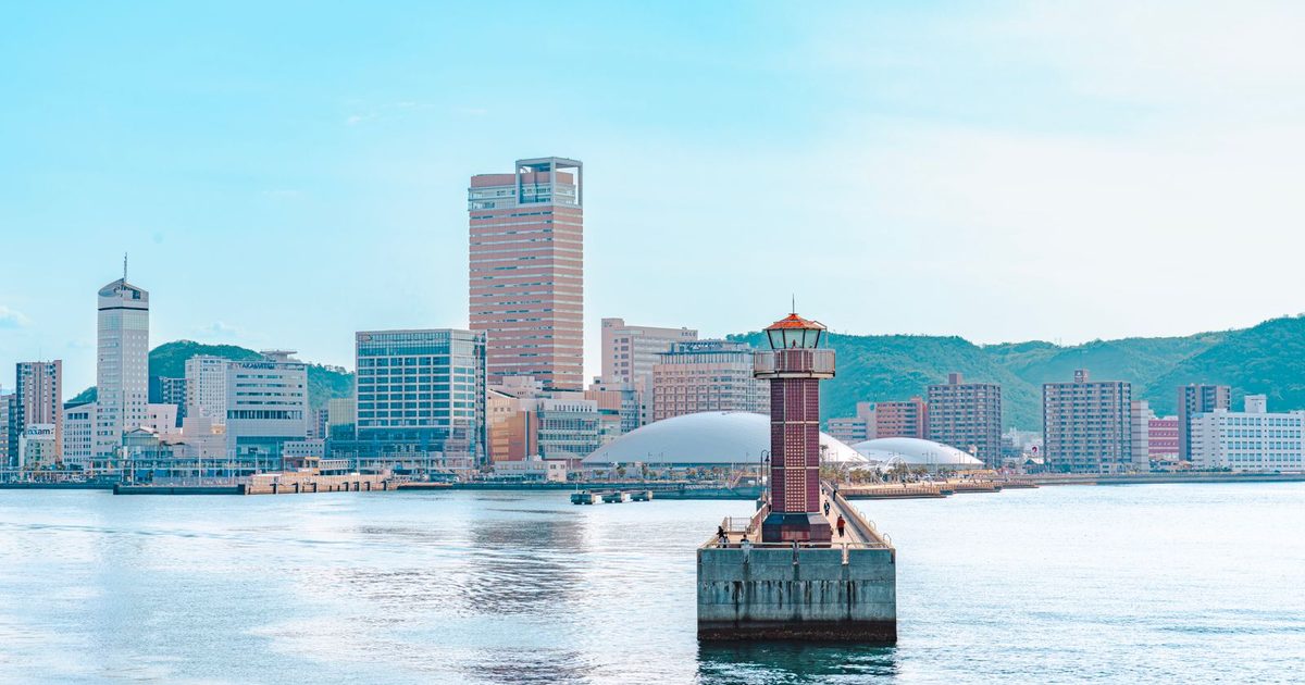 The Takamatsu skyline with a lighthouse in front, Japan